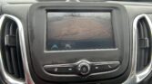 In-car display showing the rearview camera with orange parking guidelines to aid backing up; hazard light button below.