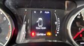 Center display shows a 'Door Open' warning with a simple car icon; surrounding gauges indicate vehicle speed and fuel/engine status, odometer reads 124,762 miles.