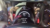 Car dashboard display showing speed 0 MPH, temperature 57°F, range 168 miles, oil life 99%, odometer 120,984 miles, and gear in Park/Drive indicators.