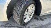 Close-up of a car’s front tire and silver alloy wheel, showing the tread pattern and Goodyear branding.