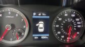 Central dashboard display shows gear in Parking with a car graphic and 70 mi range