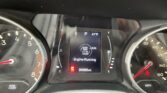 Car dashboard display showing the engine running, gear in Park, temperature 41°F, and mileage 96,668 miles (center screen with warning icons nearby).