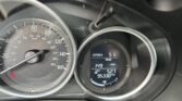 Close-up of a car dashboard showing the speedometer and a digital display with outside temperature 5°F and mileage 95,330 miles.