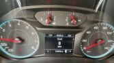 Car instrument cluster view showing fuel gauge, temperature gauge, and speedometer with digital odometer (127,676 mi) and trip info on screen.