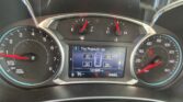 Dashboard view showing tachometer, speedometer, and a central digital display with tire-pressure readings and gear indicator (PRNDL).