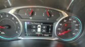Instrument cluster showing tachometer to the left, speedometer to the right, and a central digital display with tire pressure readings and odometer (105,933 miles). The gear selector shows P R N D L.