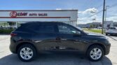Black Chevy Blazer parked in front of E-Z Loan Auto Sales on a sunny day.