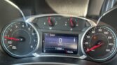 Dashboard instrument cluster showing speedometer and tachometer with central digital display reading 0 mph and 112,896 miles; gear indicator PRNDL below.