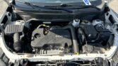 Open car hood revealing engine bay; ECOTEC engine visible in a Chevrolet front with wipers in view.