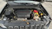 Engine bay with open hood; shows 2.4L MultiAir engine and battery on the passenger side near the grille