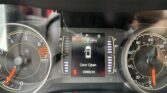 View of a car's instrument cluster displaying speedometer, tachometer, and center digital screen showing 55°F, gear P, 0 MPH, and 'Door Open' with 92,868 miles.