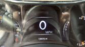 Car dashboard digital display showing 0 MPH, 54°F, and an odometer reading of 138,976 miles; gear selector near Park (P).