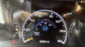 Close-up of a car dashboard showing the speedometer, time 11:51, outside temperature 54°F, and odometer reading 95,803 miles with trip and MPG indicators visible.