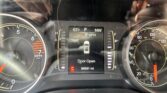 Car dashboard close-up showing outside temperature 63°F, gear in Park, speed 0 mph, door open, odometer 89,691 miles.