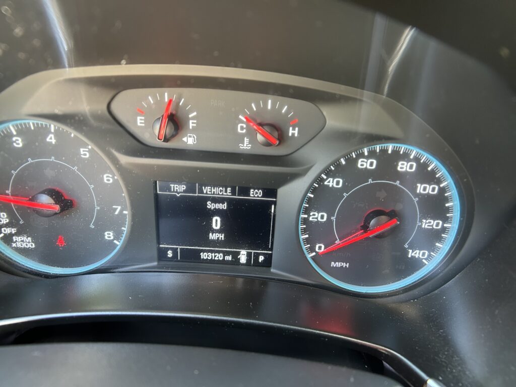 Car instrument cluster showing speedometer up to 140 mph and tachometer, fuel and temperature gauges, and digital trip readout.