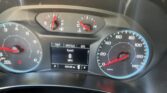 Car instrument cluster showing speedometer up to 140 mph and tachometer, fuel and temperature gauges, and digital trip readout.