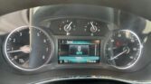 Close-up of a car instrument cluster featuring the speedometer, tachometer, and digital readout showing 0 MPH and 73,096 miles traveled.