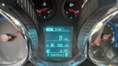 Close-up of a car's instrument cluster: tachometer left, speedometer right, center digital display shows 'TRIP OPTION' and 0 mph; gear in Park with odometer reading 38,753 miles.