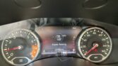 Digital instrument cluster shows engine running, with tachometer and speedometer on either side and 107,083 miles displayed on the center screen.