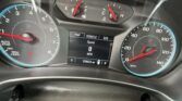Car instrument cluster showing tachometer on left and speedometer on right with digital display in center (speed 0 mph) and fuel/temperature gauges above.