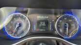 Vehicle dashboard with blue-lit analog gauges on left and right, center display shows 'Key Fob has Left the Vehicle' and 138,757 mi total miles.
