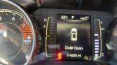Dashboard instrument cluster showing 53°F, gear in P, range 146 mi, and a 'Door Open' warning with a vehicle icon; left tachometer partially visible.