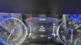 Car dashboard close-up showing illuminated blue gauges, center display reading 'Messages' with a red door‑ajar warning icon.