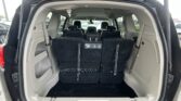 Open SUV rear with the third-row seats folded to create a large cargo area
