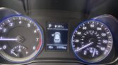 Car dashboard with tachometer on the left, speedometer on the right, and a center display showing parked gear, fuel icon, 247 mi range, and 117,776 miles (45°F).