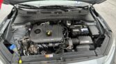 Open car hood revealing engine bay with DOHC 16V engine cover, battery, and fluid reservoirs visible beneath the windshield wipers.