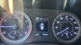 Car dashboard with tachometer on left, speedometer on right, and central digital display showing parked gear, car icon, temp 55°F, and 69,309 miles