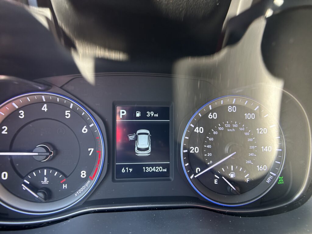 Dashboard view showing the car in Park, fuel range 39 miles, and odometer 130,420 miles with speedometer on the right and tachometer on the left.