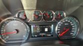 Close-up of a car instrument cluster: left tachometer, right speedometer, and center digital display showing 0 mph and 131,343 miles; gear indicator reads PRNDL.