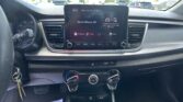 Center console touchscreen showing 'Radio/Media Off' with car climate controls beneath, seen from the driver's perspective in a parked car.
