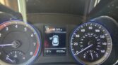 Driver's dashboard with analog tachometer on left and speedometer on right, central digital display showing park, fuel range 149 miles, outside temperature 81°F and odometer 89,220 miles