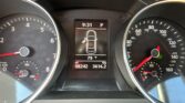 Center dashboard display shows time 9:31, gear in P, car outline with left door open, 79°F, and odometer 98,242 miles.