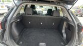 Open SUV hatch showing a spacious cargo area with folded rear seats and the dashboard visible through the rear window.