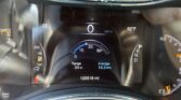 Car dashboard display showing 0 mph, 62°F outside, 12,0516 miles on odometer, 34-mile range, and 16.2 MPG average.
