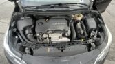 Open hood view of a Chevrolet engine bay with an ECOTEC engine cover visible
