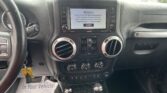Car dashboard center with touchscreen displaying an important notice and an ACCEPT button, flanked by control buttons and air vents.