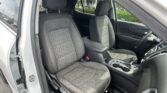 Front passenger and driver seats in a gray fabric car interior with quilted patterns and a center console visible