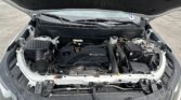 Open car hood revealing an Ecotec engine bay with windshield wipers visible, battery and various components exposed.