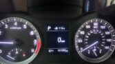 Close-up of a car instrument cluster showing left tachometer, right speedometer, and center display with gear 'P' and 114 mi range (odometer 101,391 mi).