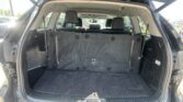 Open SUV/hatch cargo area with third-row seats folded down, showing a spacious trunk.