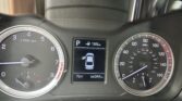 Car dashboard: left tachometer, right speedometer, center digital display showing parked gear, 188 mi range, and car icon; outside temp 76°F, odometer 66,344 mi.