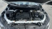 Open car hood showing engine bay with ECOTEC engine and battery visible at the front of the compartment