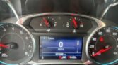 Close-up of a car dashboard: tachometer on left, speedometer on right, center readout shows 0 MPH and 101246 miles with PRNDL indicator below.