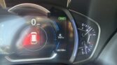 Dashboard view: digital speedometer shows 0 MPH with a glowing blue arc and a green SMART indicator nearby; fuel and mileage readouts visible (105150 mi).
