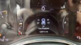 Vehicle instrument cluster showing 0 mph, 97 mi range, 72°F outside, and odometer reading 128,714 miles with tire-pressure data displayed.