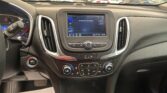 Infotainment screen in a car shows 'No Device Connected' with climate controls below and a busy parking lot outside the windshield.